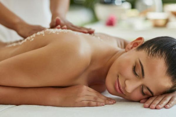 A person is receiving a spa treatment with a massage.