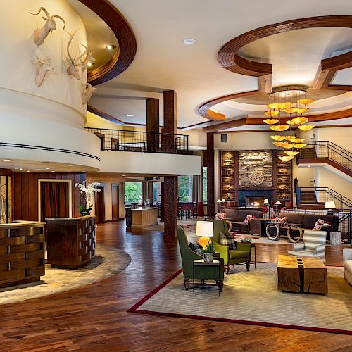 Lake Arrowhead Resort lobby with check-in desk, seating area, and fireplace