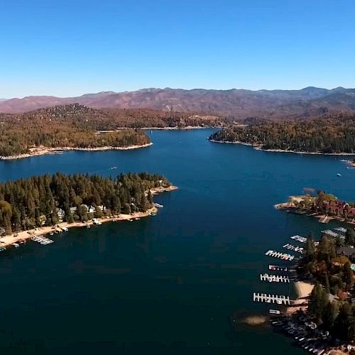 Aerial View of Lake Arrowhead surrounded by forest and mountains